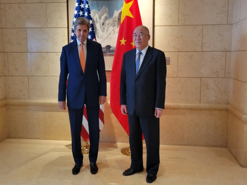 John Kerry, US special presidential envoy for climate, left, greets Xie Zhenhua, China's special envoy for climate change, ahead of talks in Beijing, China, on Monday, July 17, 2023. Kerry opened the first major climate talks with Chinese officials in almost a year, as both sides pledged to work for tangible results despite deep tensions between the superpowers. Photographer: Jennifer A. Dlouhy/Bloomberg via Getty Images