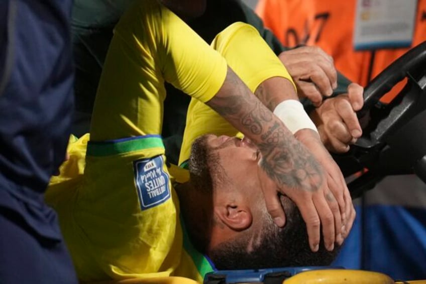 neymar leaves brazil match in tears with left knee injury team doctor says severity unknown