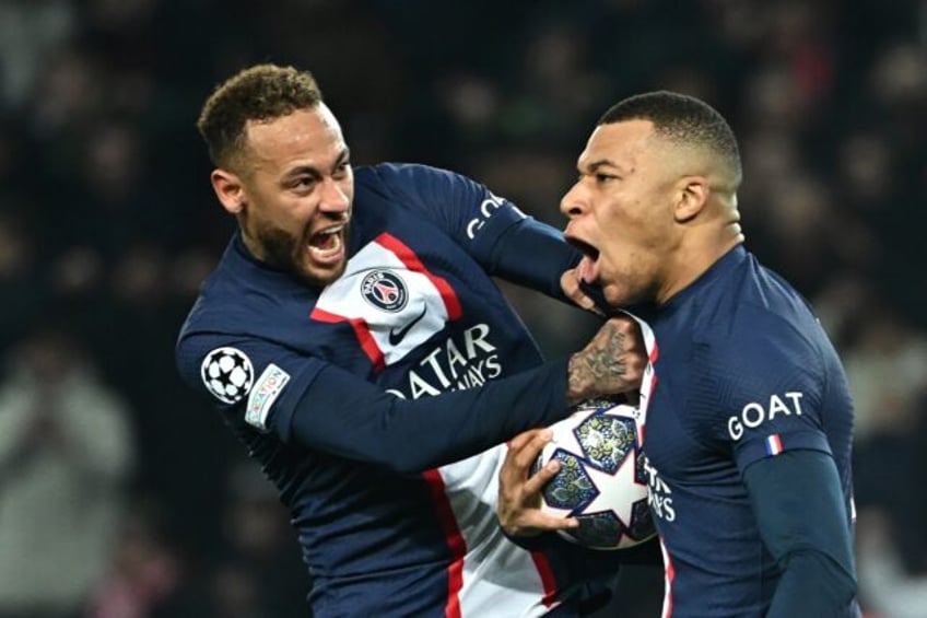 Brazil star Neymar (L) celebrates with teammate Kylian Mbappe during their spell at Paris