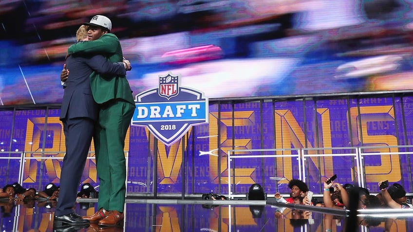 Lamar Jackson hugs Roger Goodell