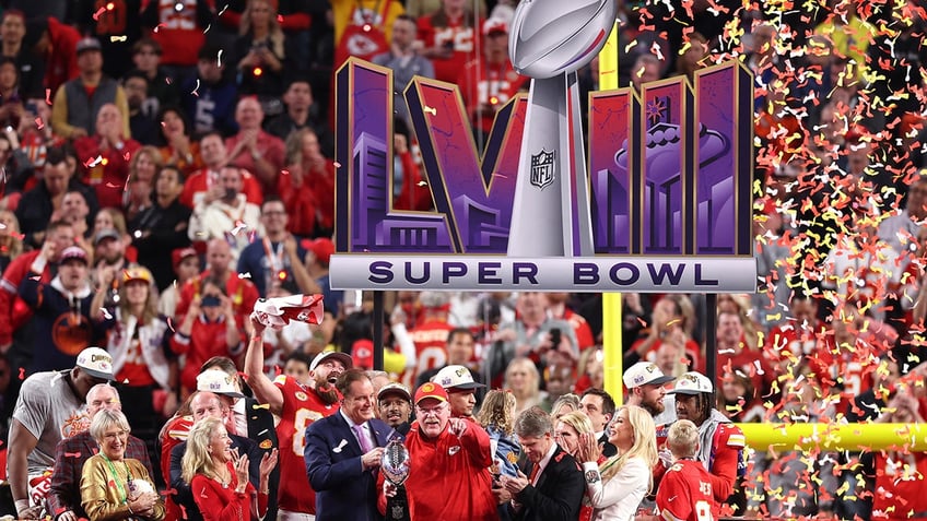 Head coach Andy Reid of the Kansas City Chiefs holds the Lombardi Trophy