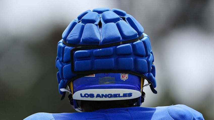 nfl exec suggests guardian caps worn to protect players during practices could one day debut in games
