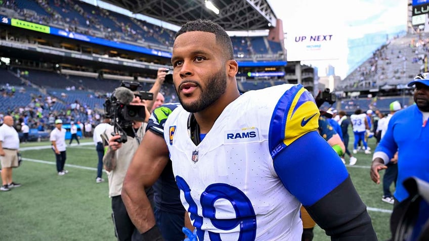 nfl fines rams aaron donald for hitting seahawks qb geno smith during oh my god moment report