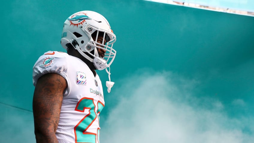 Xavien Howard walks toward the football field