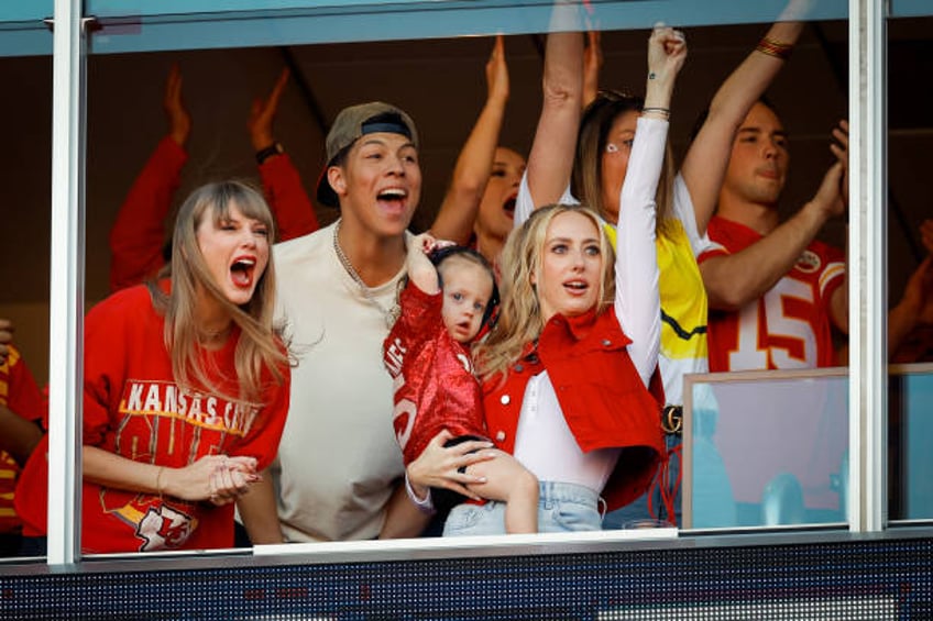 Taylor Swift and Brittany Mahomes react during a game between the Los Angeles Chargers and Kansas City Chiefs at GEHA Field at Arrowhead Stadium on...