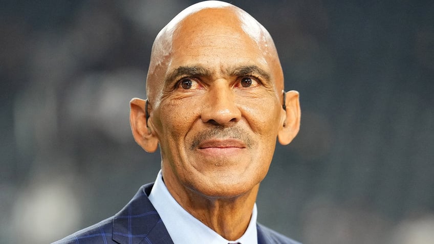 Tony Dungy looks on