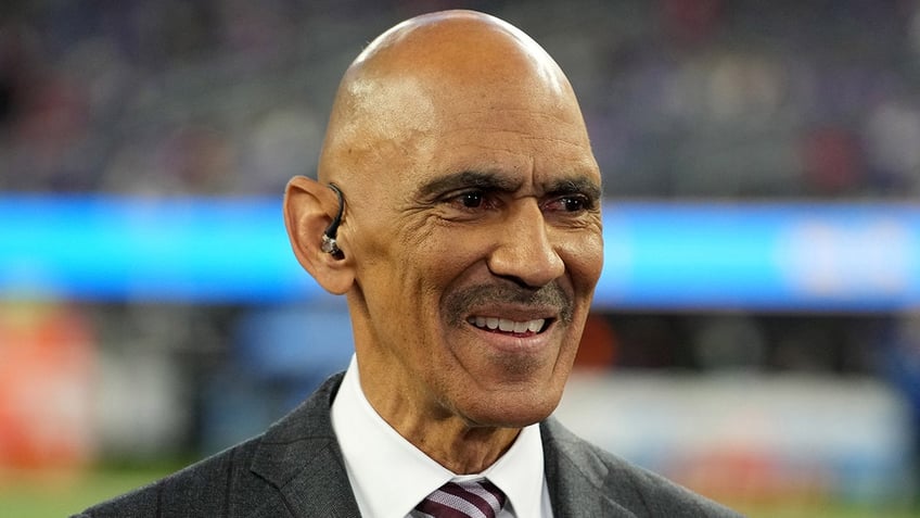 Tony Dungy looks on