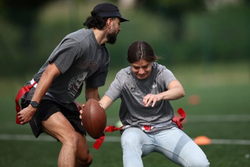 Elisa De Santis, the captain of the women's French flag football team, takes on an opponen