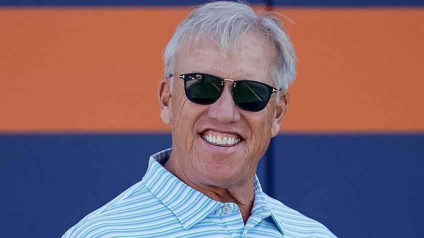 John Elway smiles