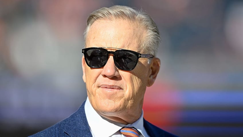 John Elway looks on