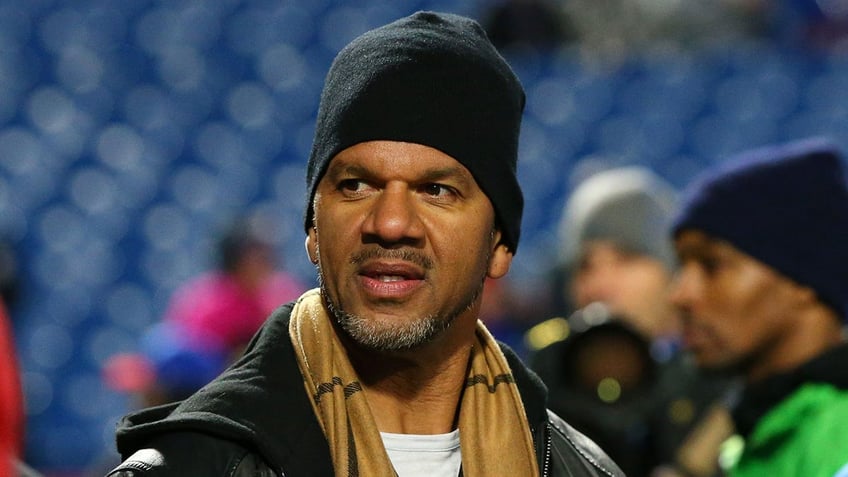 Andre Reed looks on