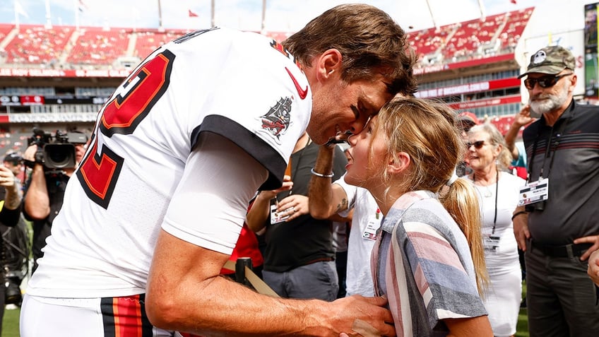 Tom Brady with his daughter before a game