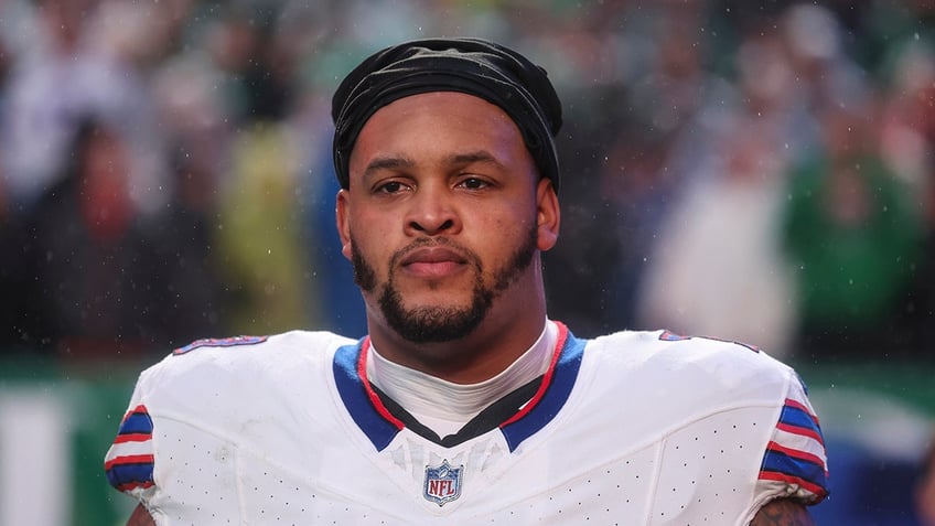 Dion Dawkins looks on before a game