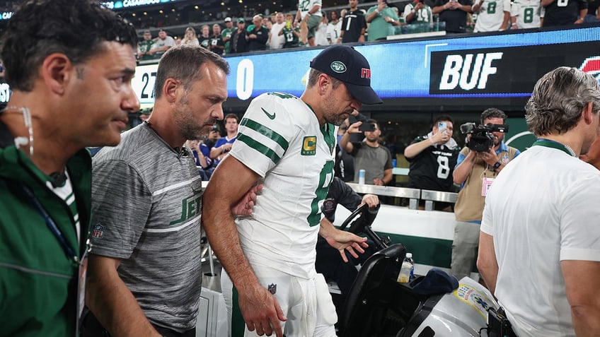 nfl stars react to aaron rodgers ankle injury in jets debut praying for the best