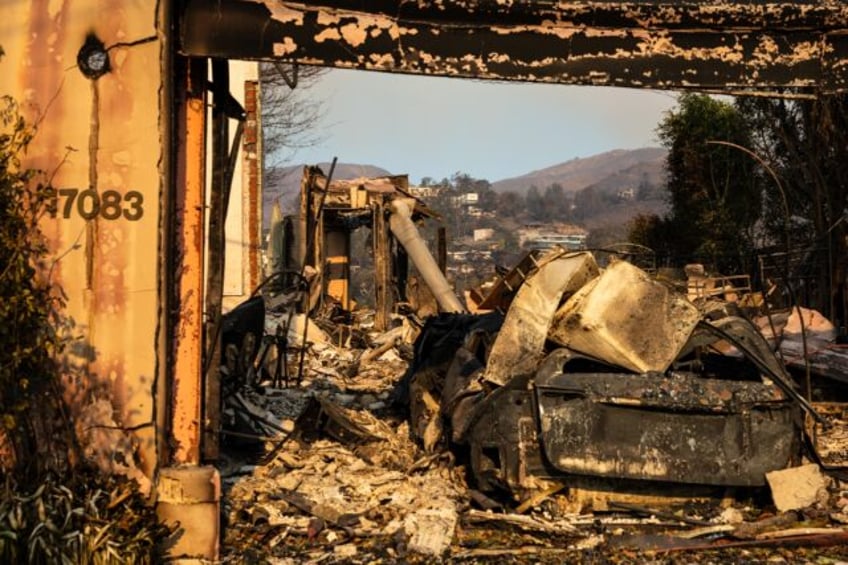 The remnants of a house, destroyed in the Palisades Fire, are seen in the Pacific Palisade