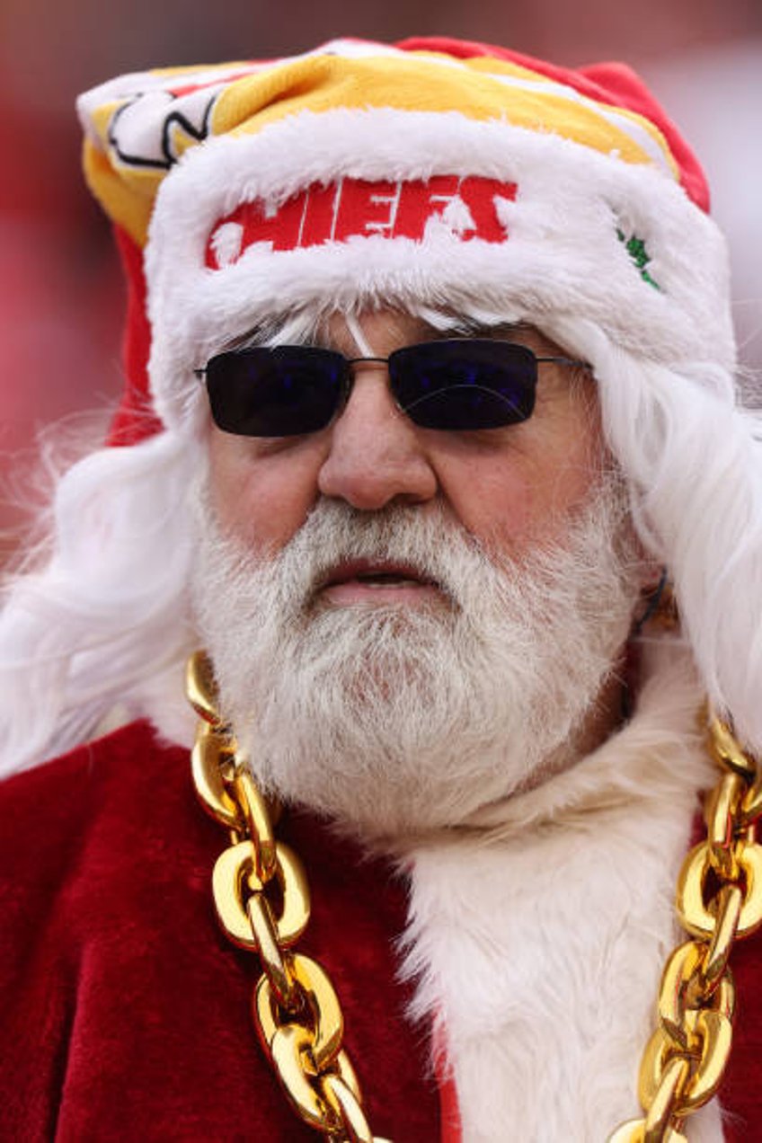 Fan is seen dressed as Santa Claus during a game between the Las Vegas Raiders and the Kansas City Chiefs at GEHA Field at Arrowhead Stadium on...