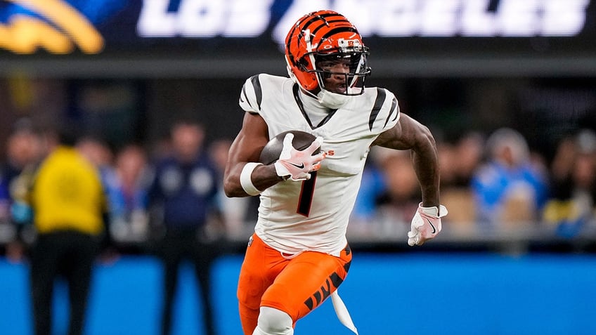 Cincinnati Bengals wide receiver Ja'Marr Chase, #1, runs with a catch in the first quarter of the NFL Week 11 game between the Los Angeles Chargers and the Cincinnati Bengals at SoFi Stadium in Inglewood, California, on Sunday, Nov. 17, 2024.