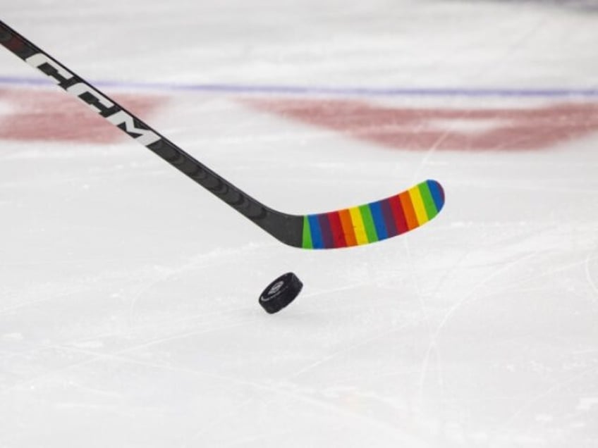 nhl caves to activists reverses pride tape ban