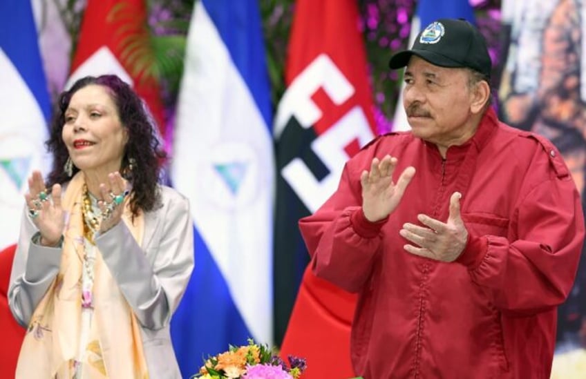 Nicaraguan President Daniel Ortega and Vice President Rosario Murillo are seen during an o