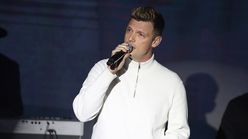 Nick Carter singing into microphone