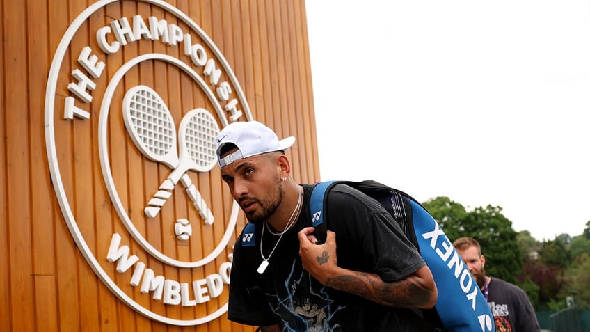 Nick Kyrgios walks into Wimbledon