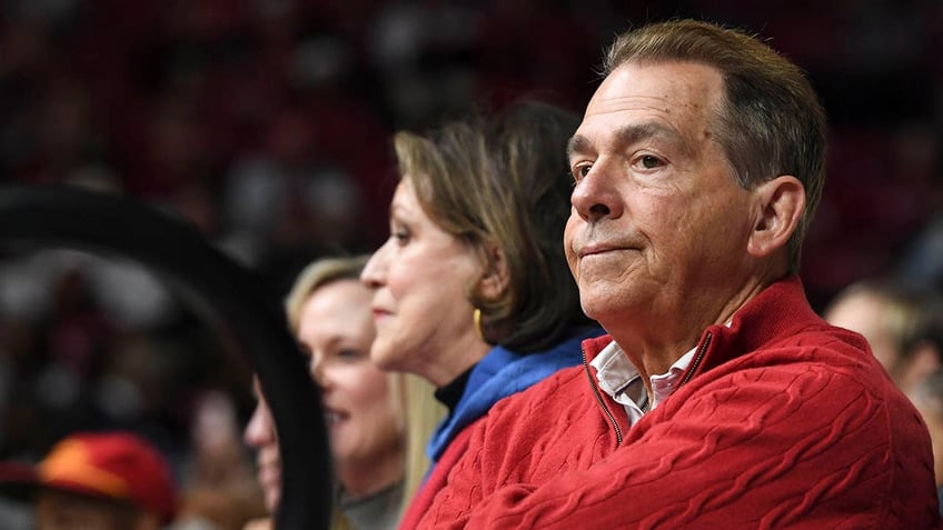 Nick Saban looks on