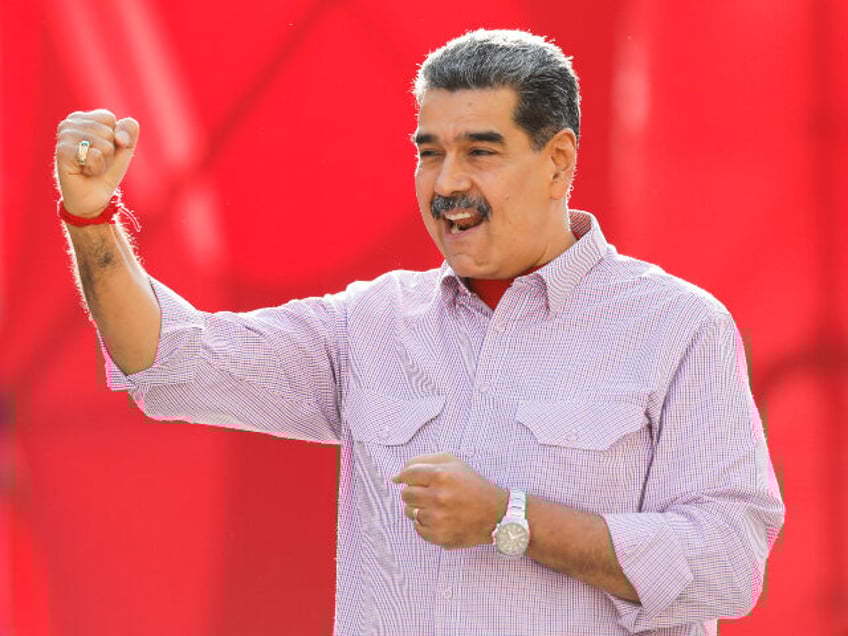 Venezuela's President Nicolás Maduro gestures to supporters during a rally in Caraca