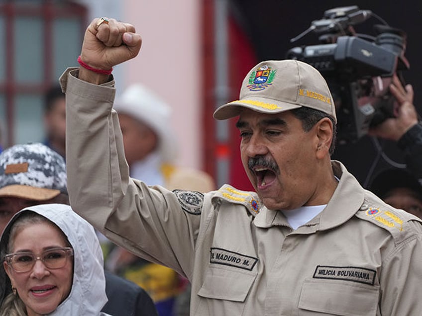 President Nicolas Maduro gestures to supporters during an event marking the 165th annivers