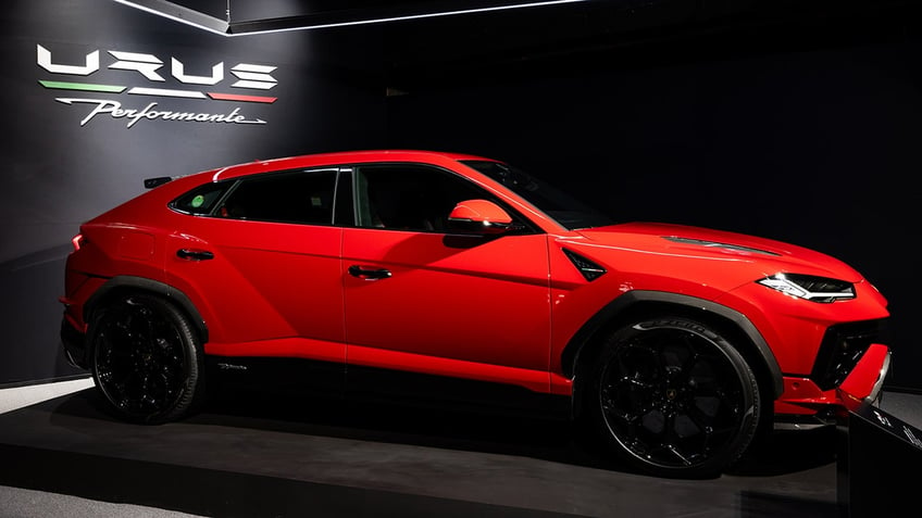 Red Lamborghini with four doors, model URUS on display