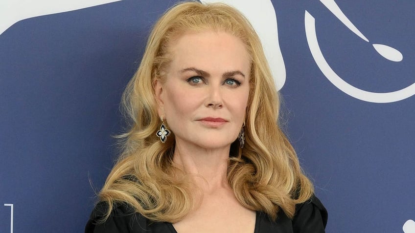 nicole kidman against blue background