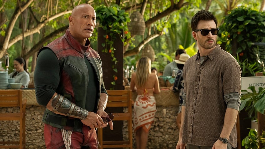 Dwayne Johnson and Chris Evans in a scene from "Red One"