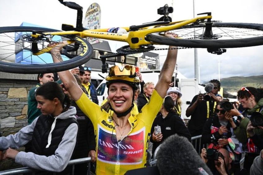 Katarzyna Niewiadoma celebrates after winning her maiden women's Tour de France crown