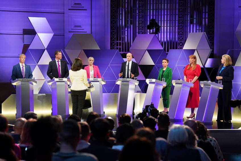 (left-right) Reform UK leader Nigel Farage, leader of Plaid Cymru Rhun ap Iorwerth, Liberal Democrat deputy leader Daisy Cooper, Stephen Flynn of the SNP, co-leader of the Green Party Carla Denyer, deputy Labour leader Angela Rayner and Commons Leader Penny Mordaunt, take part in the BBC Election Debate hosted by BBC news presenter Mishal Husain (front), at BBC Broadcasting House in London, ahead of the General Election on July 4. Picture date: Friday June 7, 2024. (Photo by Stefan Rousseau/PA Images via Getty Images)