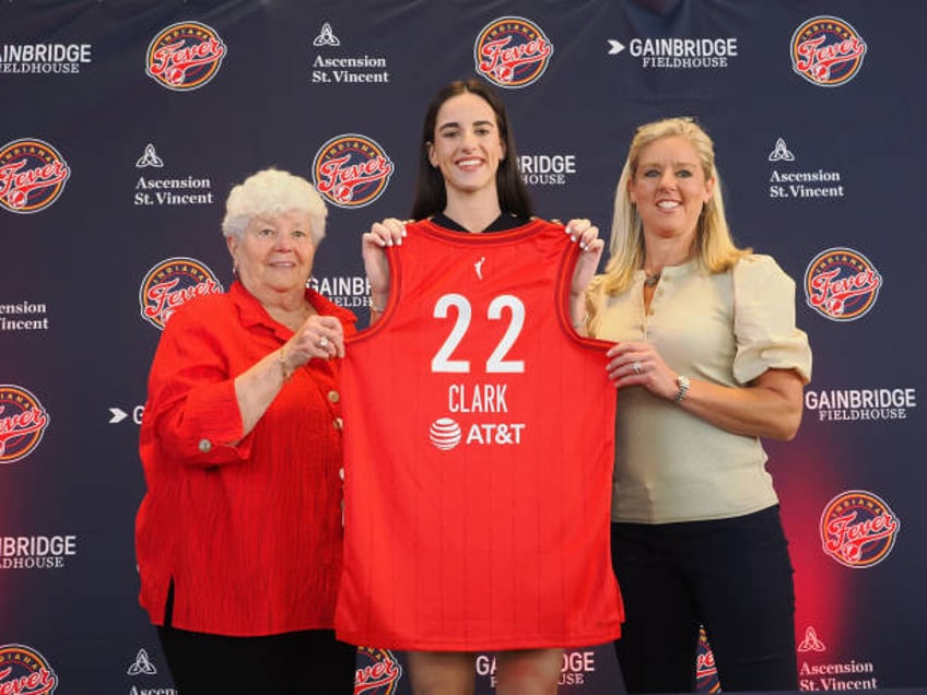 Caitlin Clark of the Indiana Fever poses for a photo with Lin Dunn and Christie Sides during her introductory press conference on April 17, 2024 at...