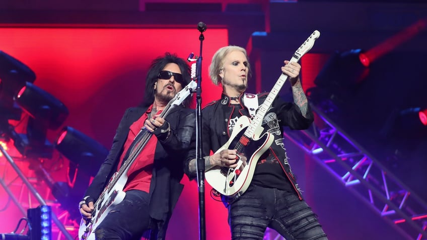 nikki sixx and john 5 on stage during 2023 tour