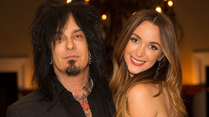 courtney sixx smiling with husband nikki sixx