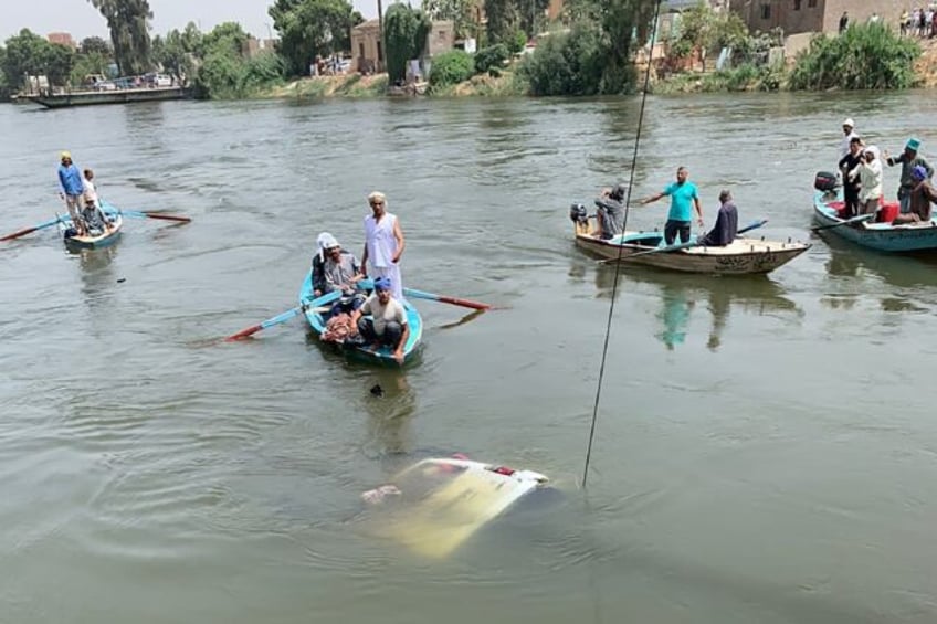 Villagers used small boats to row out and try to save people from the sunken minibus