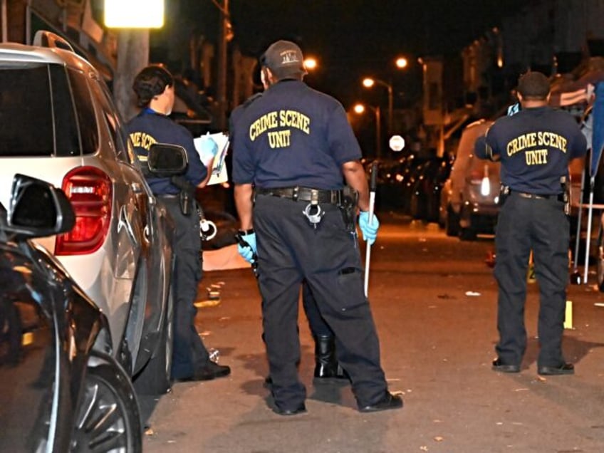 PHILADELPHIA, UNITED STATES - JULY 21: Crime scene unit at the scene of a mass shooting wi