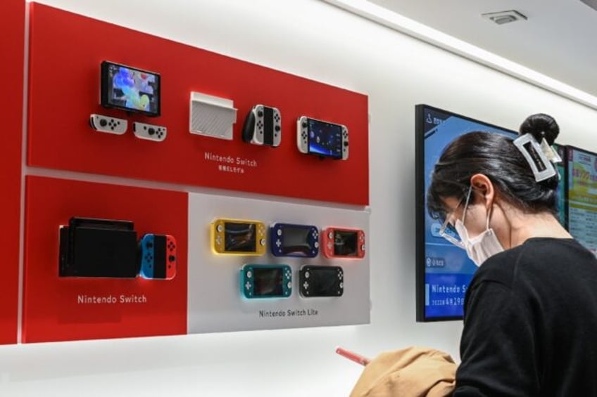 Japanese gaming giant Nintendo raised its annual forecasts on Tuesday after strong first-h