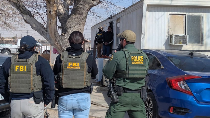 Officers from Homeland Security and the FBI conduct immigration enforcement in El Paso, Texas