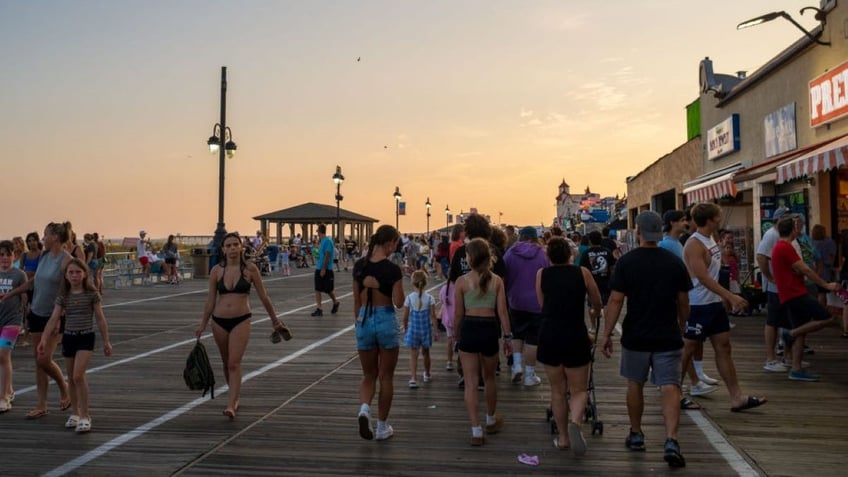 People walk on the Ocean City boardwalk in New Jersey.