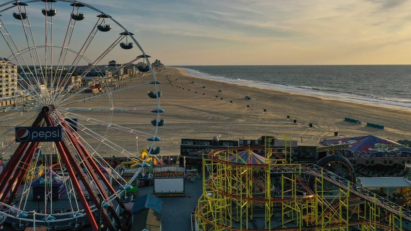 Ocean City boardwalk with ferris wheel at sunset