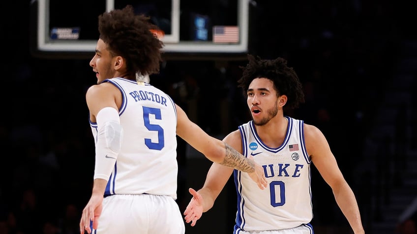 Duke players high fiving