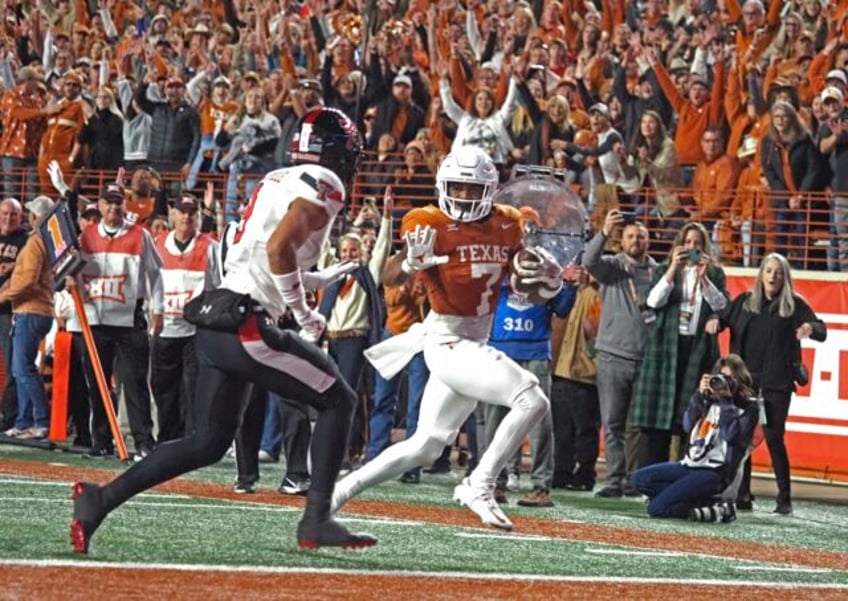 no 7 texas overwhelms texas tech 57 7 to reach big 12 championship game