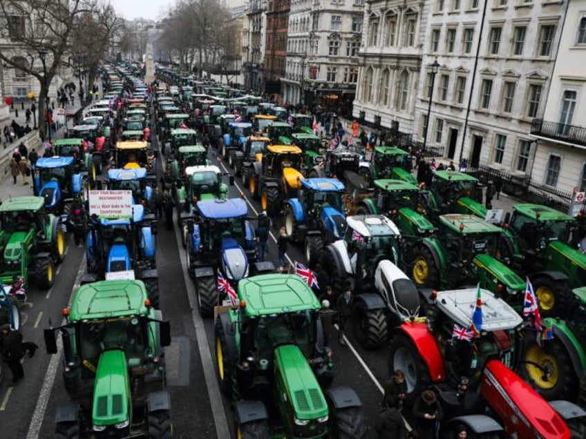 LONDON, ENGLAND - FEBRUARY 10: Tractors park in Whitehall during a farmers protest on Febr