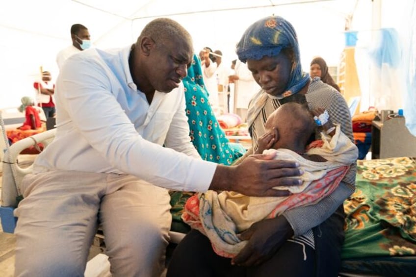 British Foreign Secretary David Lammy meets an acutely malnourished infant at a clinic for