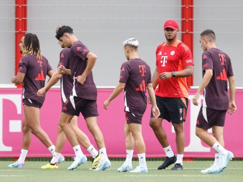 Bayern Munich's Belgian coach Vincent Kompany (2nd R) says he feels no nerves ahead of his