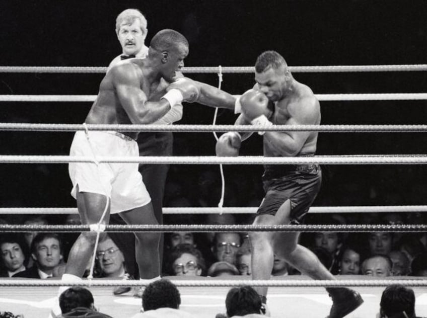 Undefeated heavyweight champion Mike Tyson (right) was expected to make short work of Jame