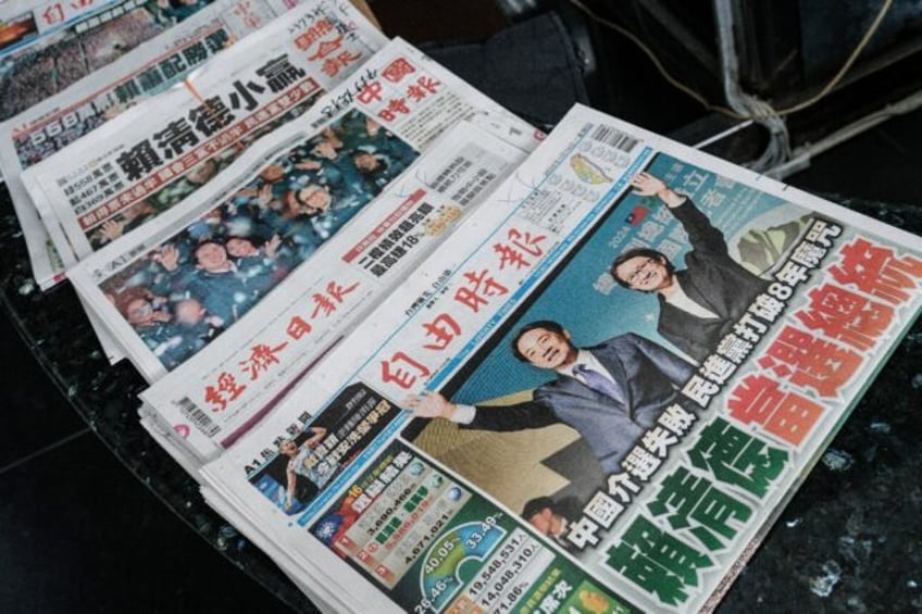 Taiwanese newspapers show the ruling Democratic Progressive Party's victory in the presidential election on the front pages a day after the poll