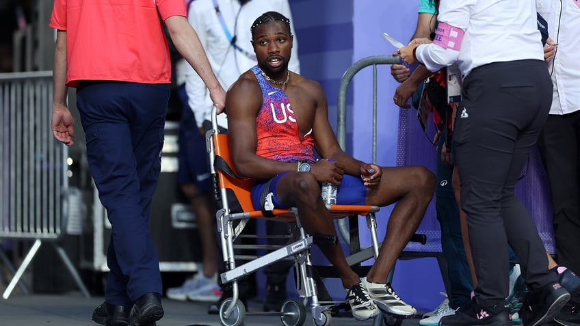 Noah Lyles in wheelchair